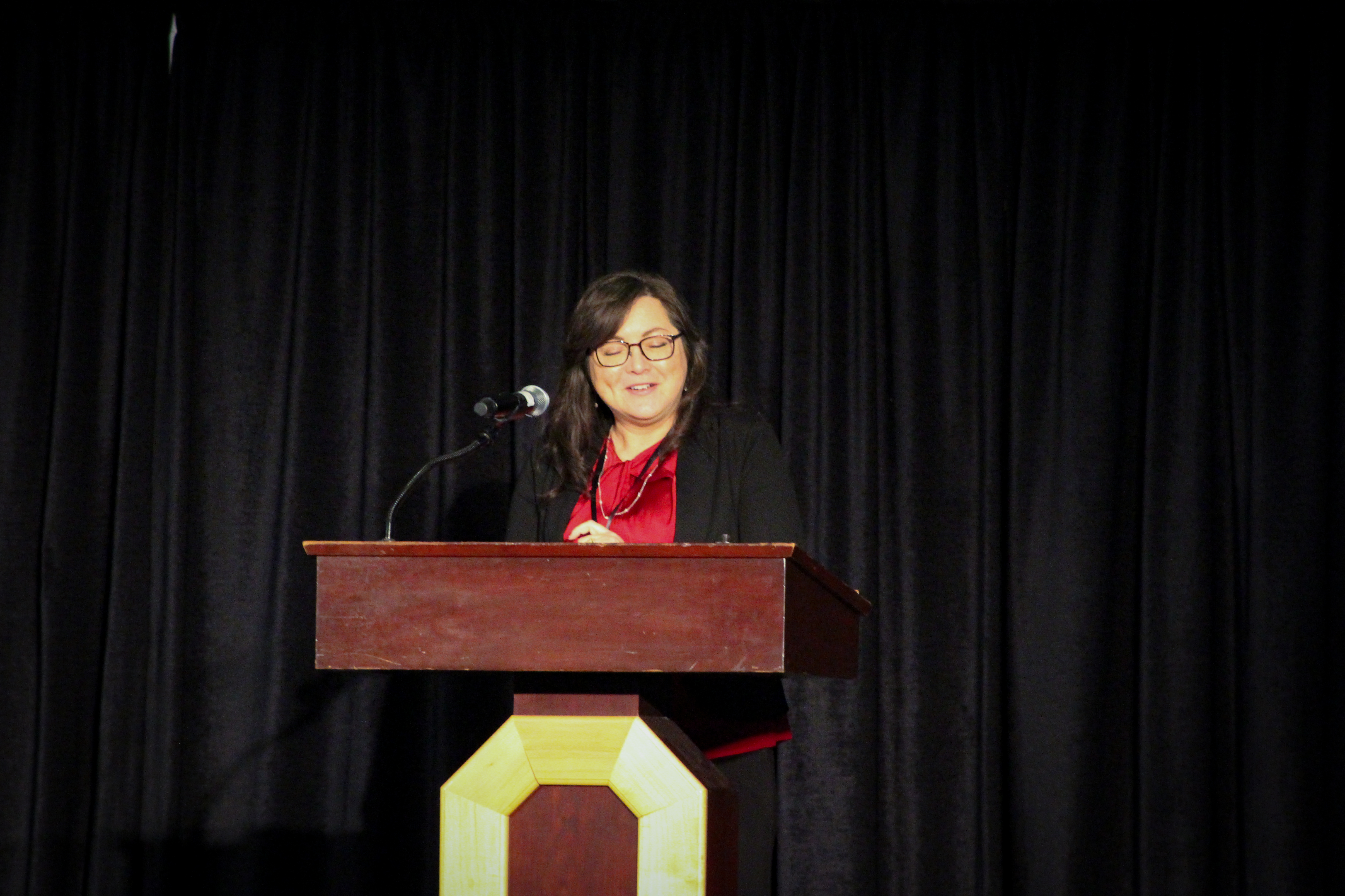 Cynthia Gerhardt speaking at podium