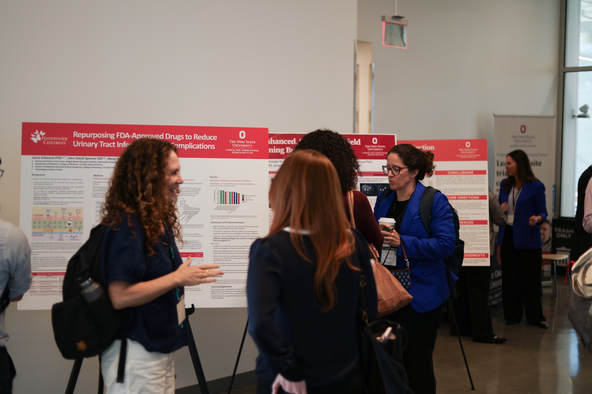 Attendees interacting during research showcase reception