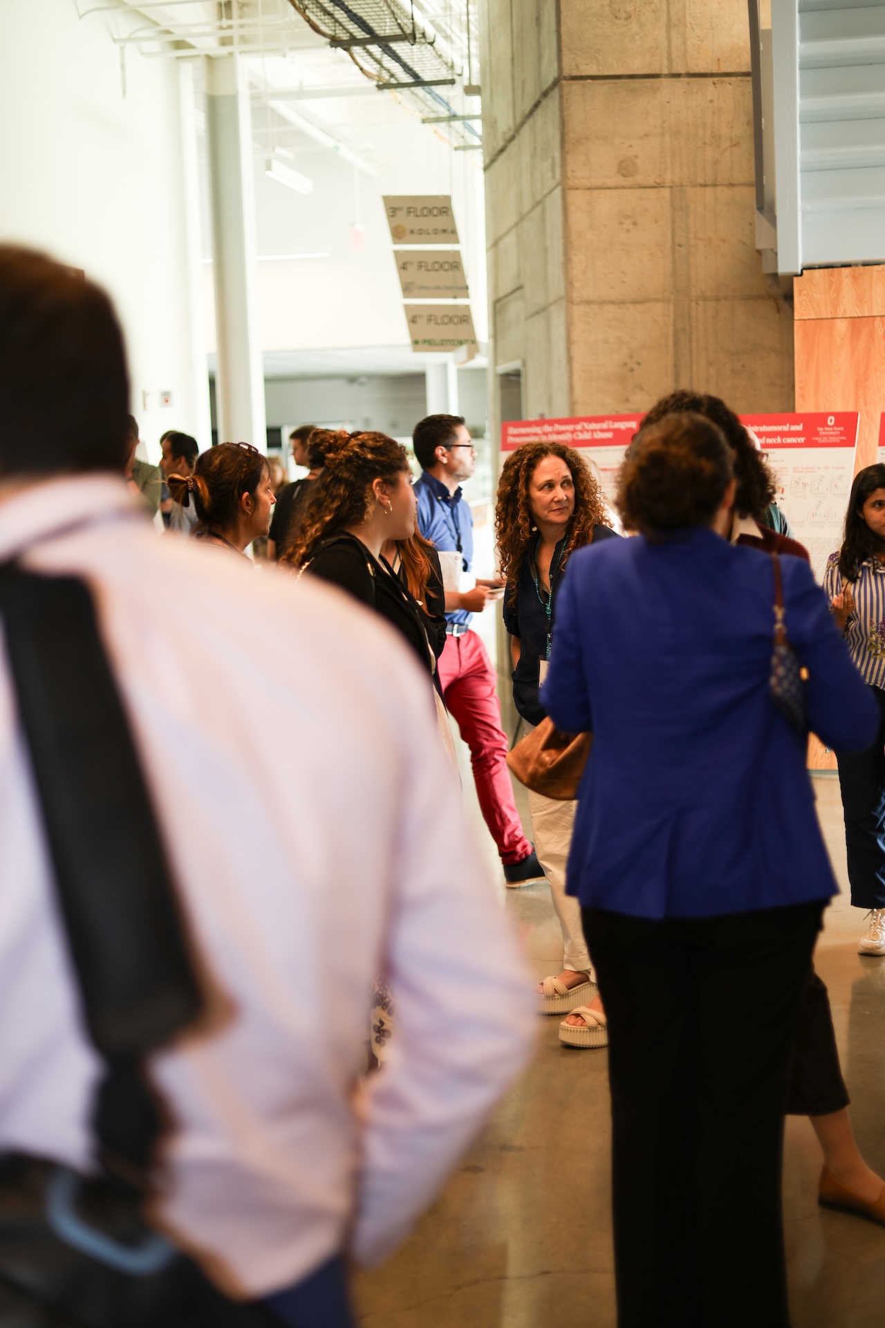 Faculty interacting during poster session