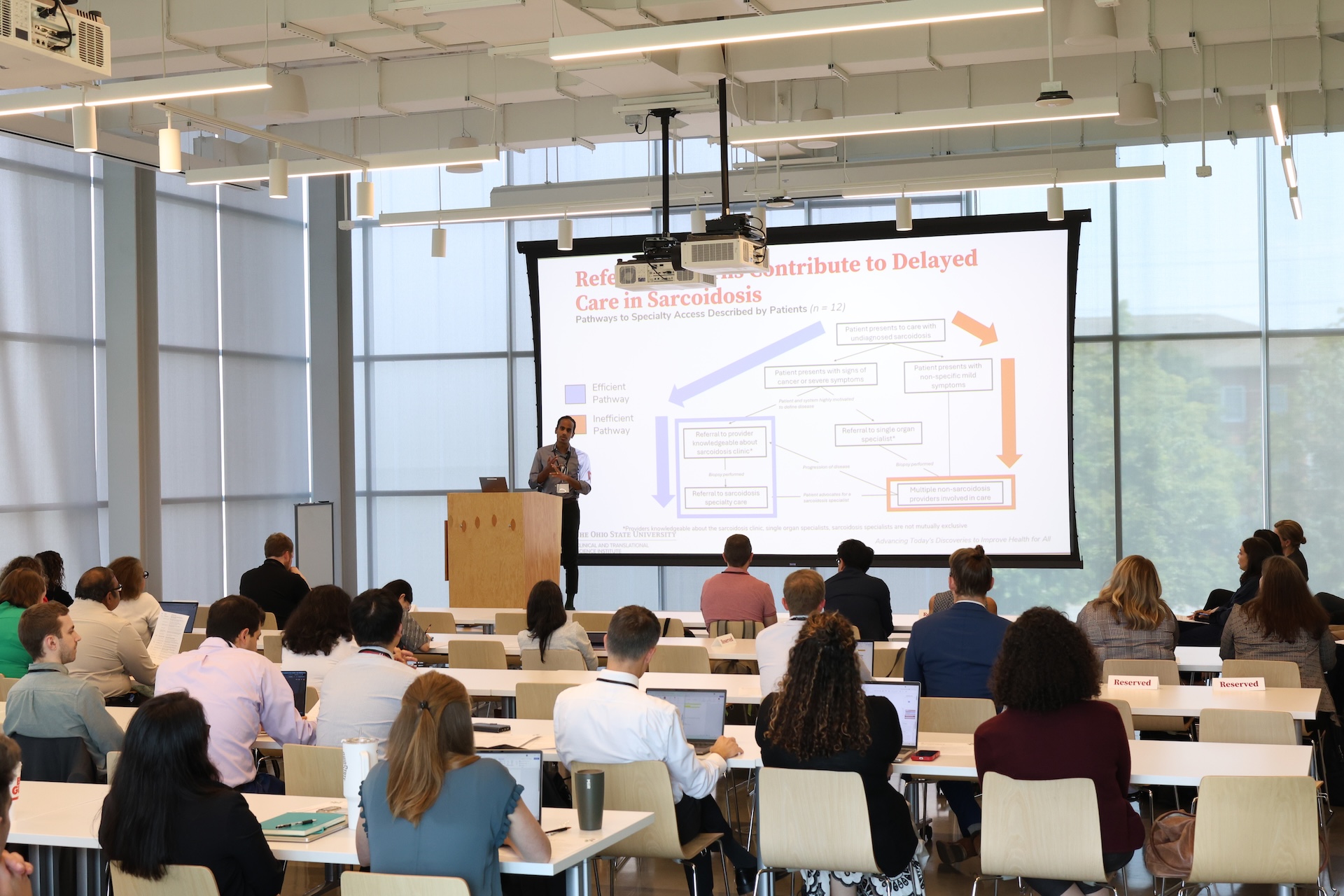 John Odackal addressing the attendees at the research showcase