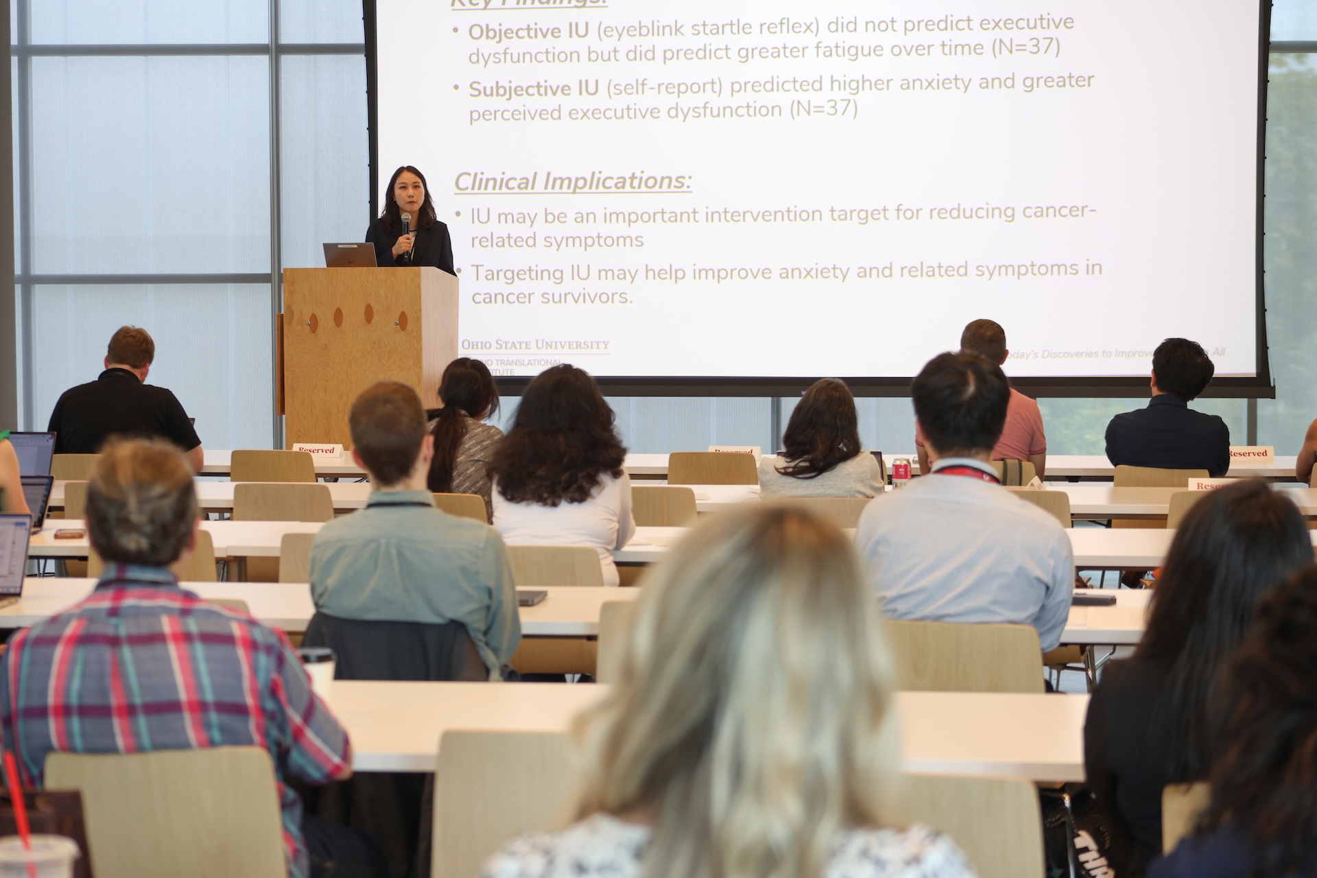 Presenter addressing attendees at the research showcase