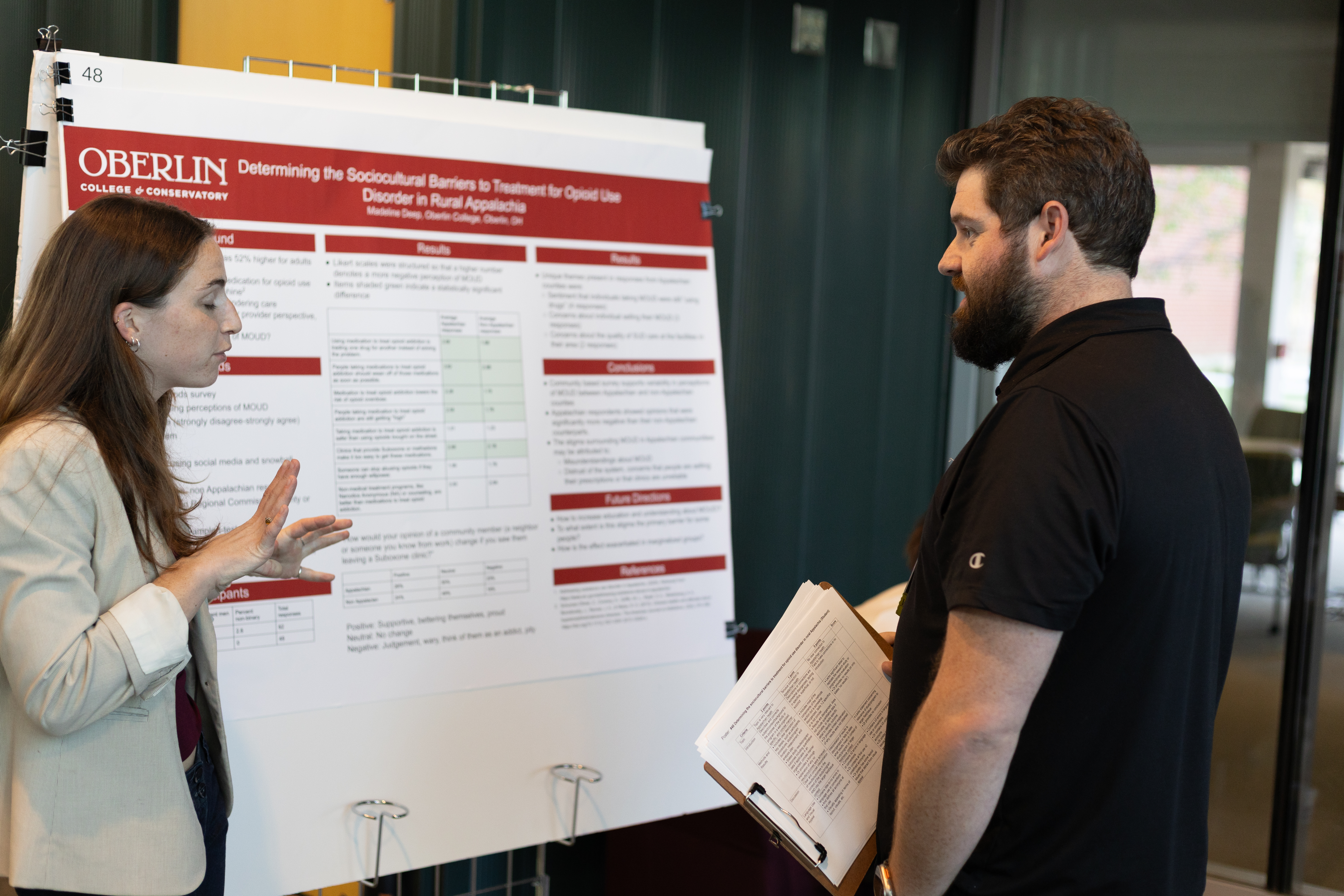 Poster presenters interacting during poster session