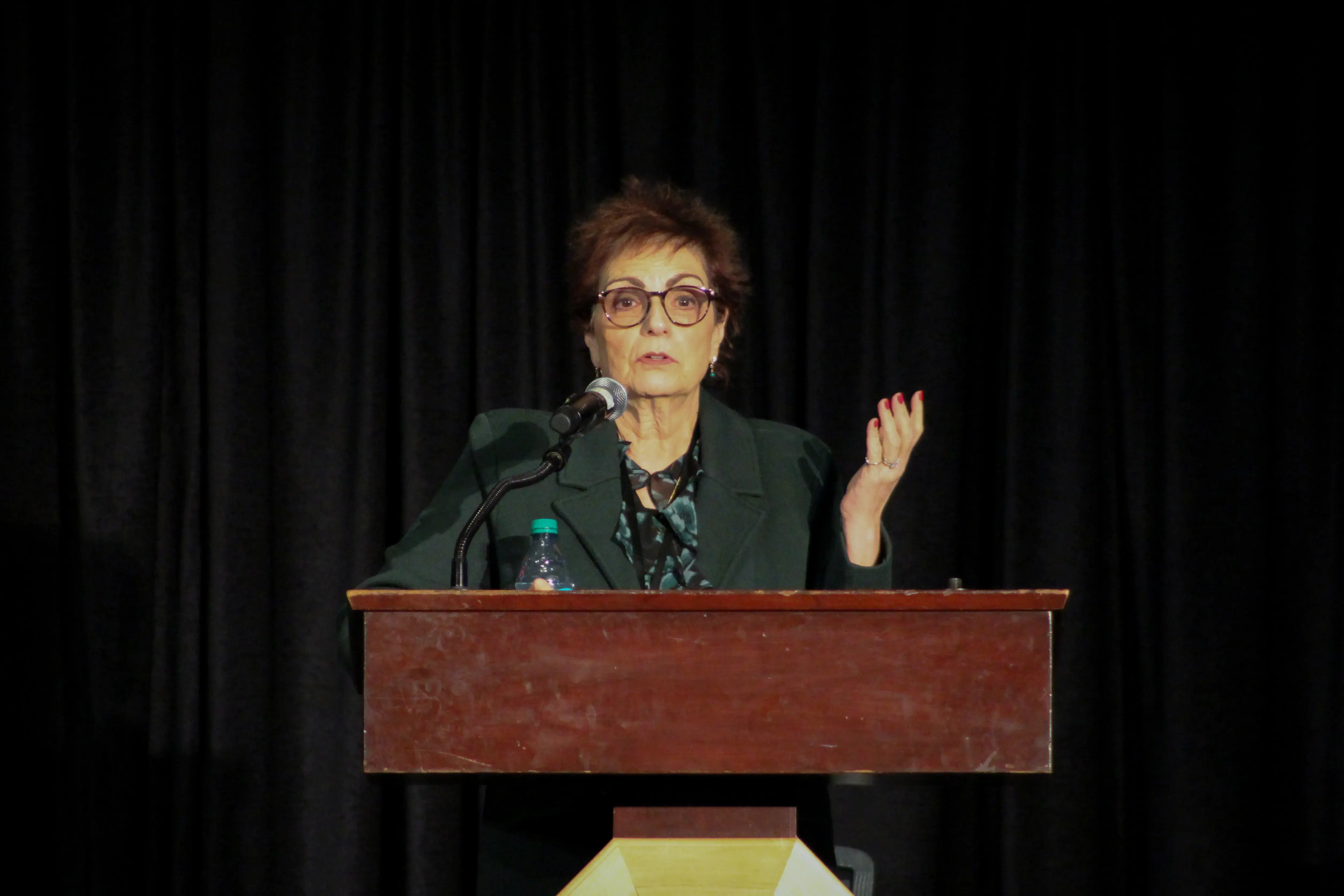 Dr. Electra D. Paskett speaking on podium