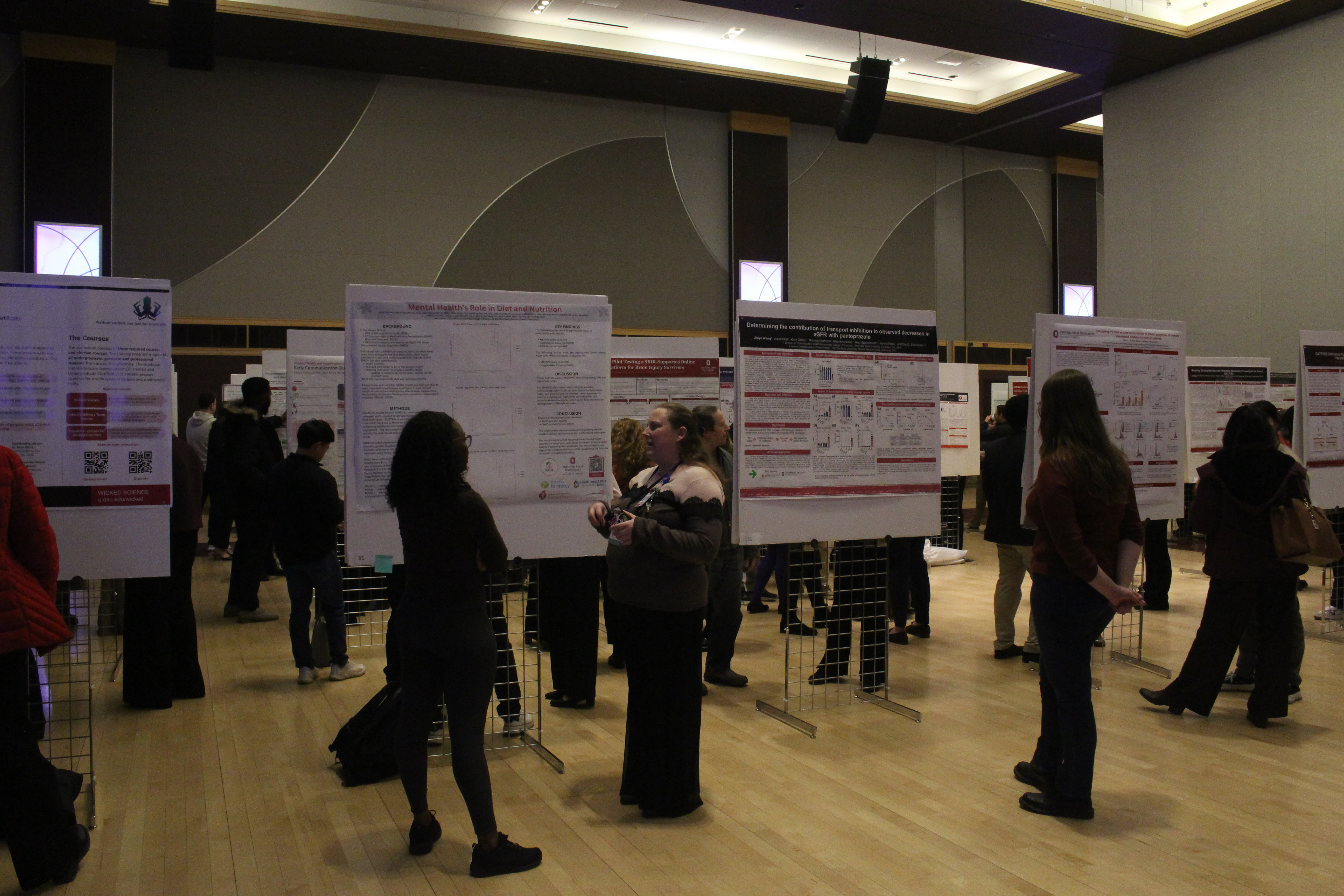 Group of people interacting at scientific meeting