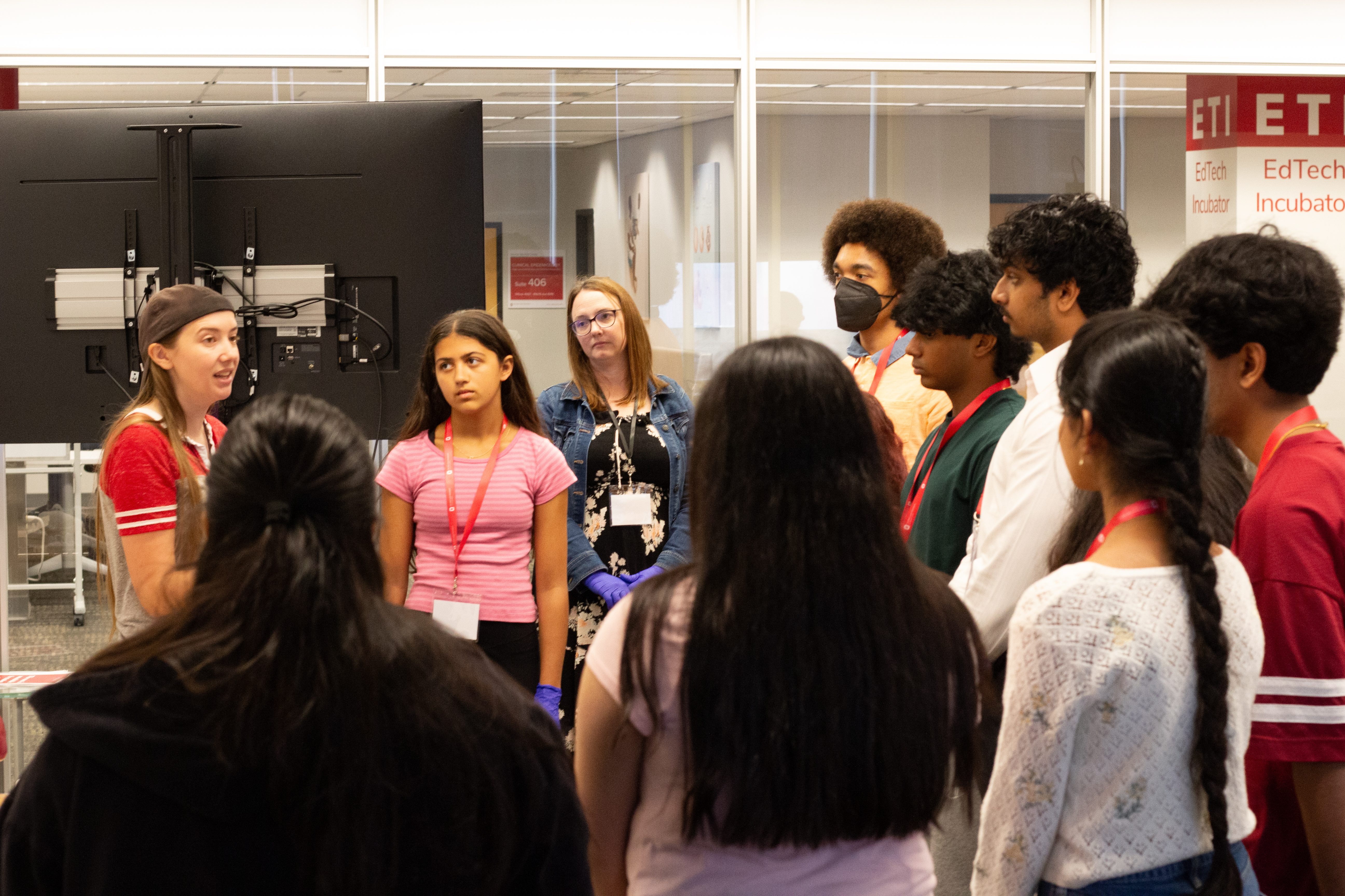 Participants in a room learning about 3D printing