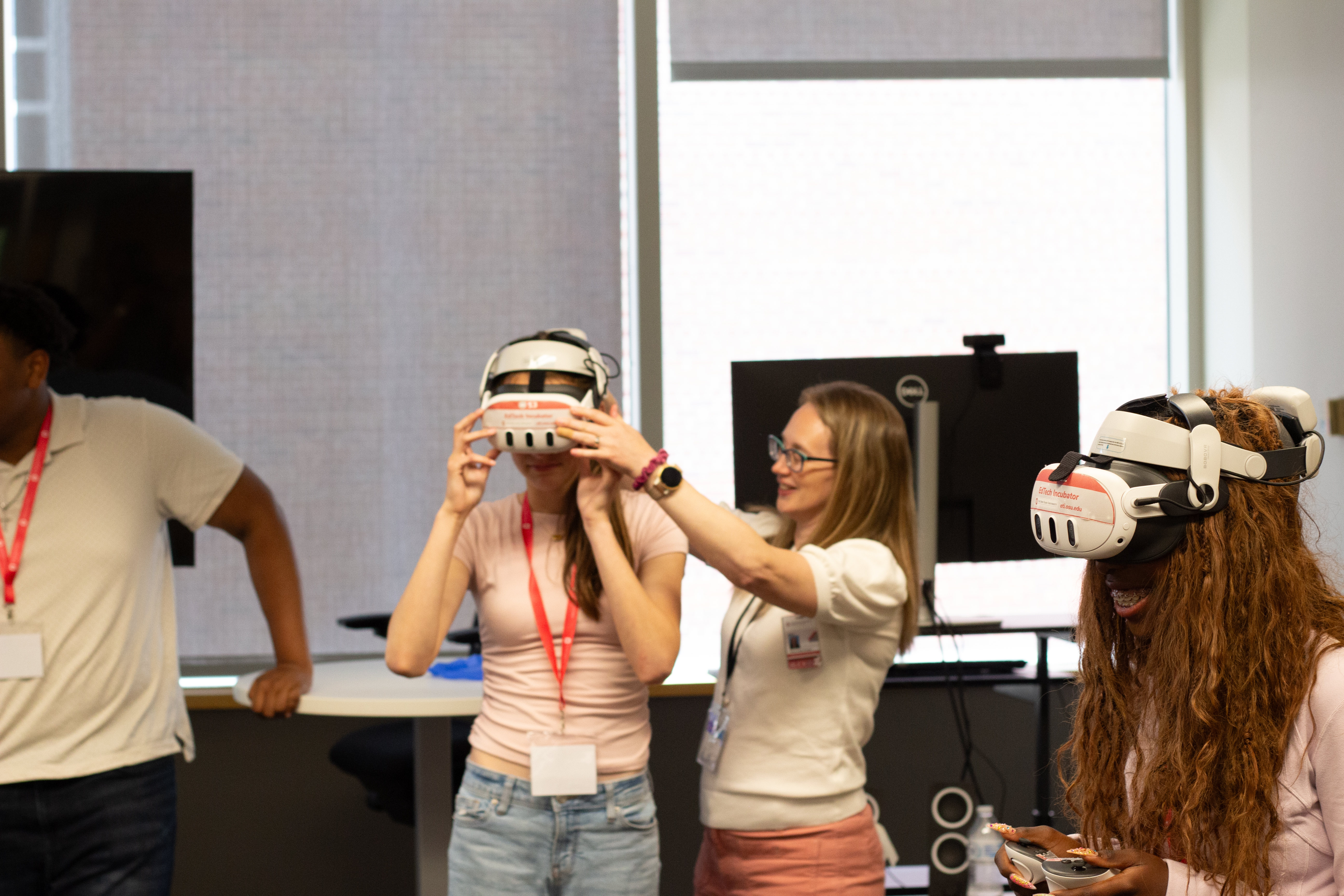 Facilitator placing headset on participant's head