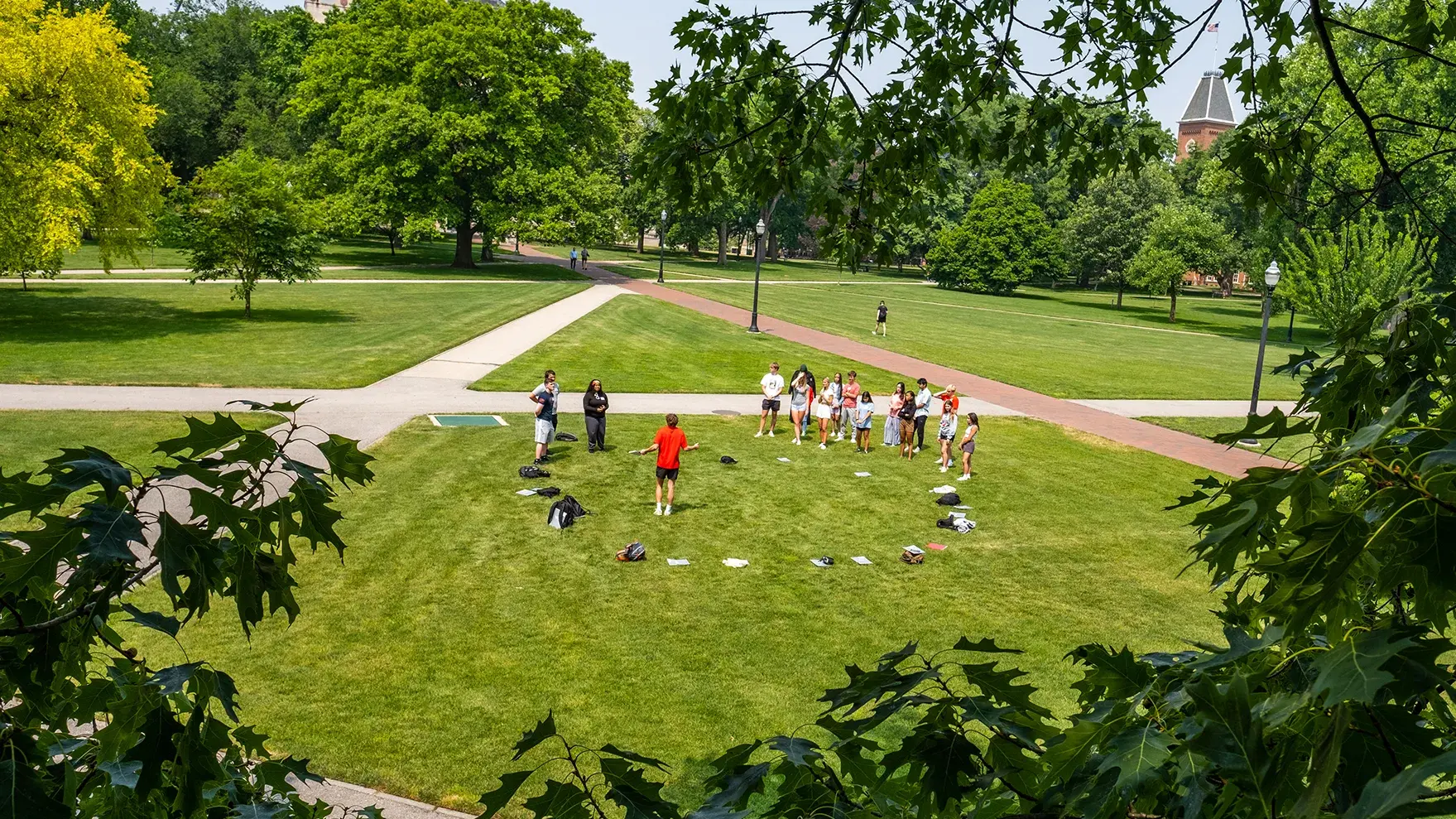 students form a circle at the oval on The Ohio State University campus