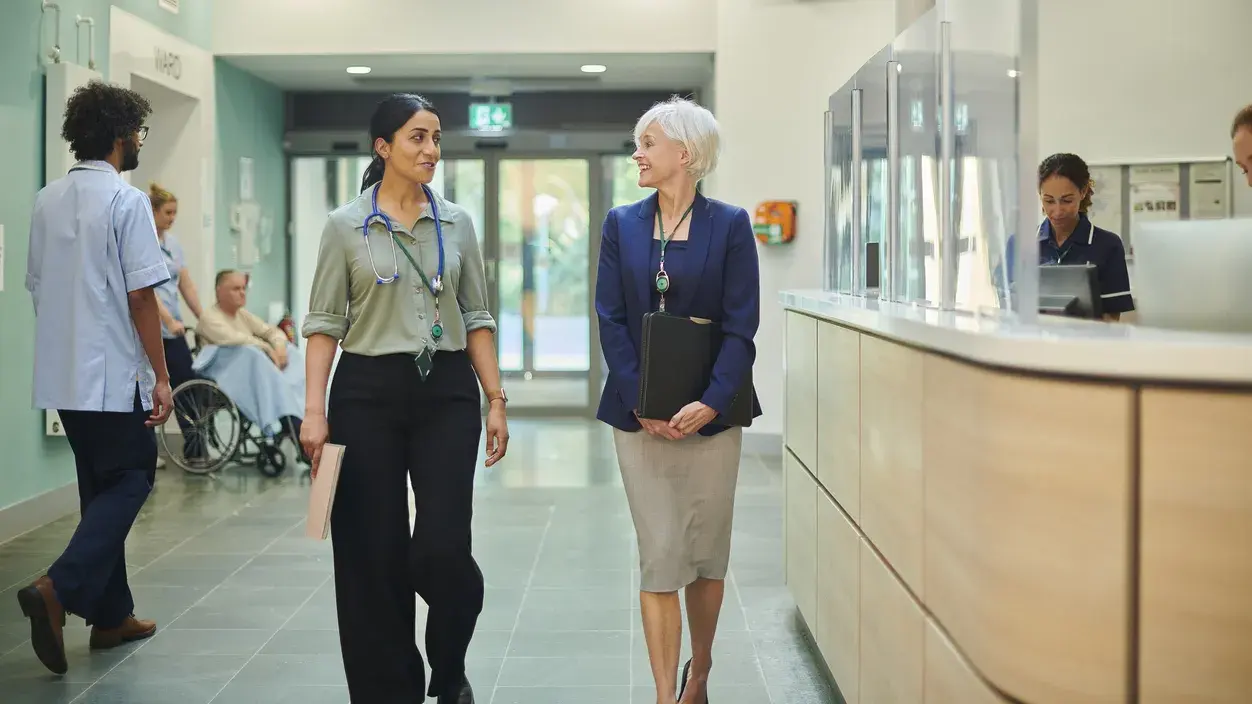 Hospital administrators walking in hospital