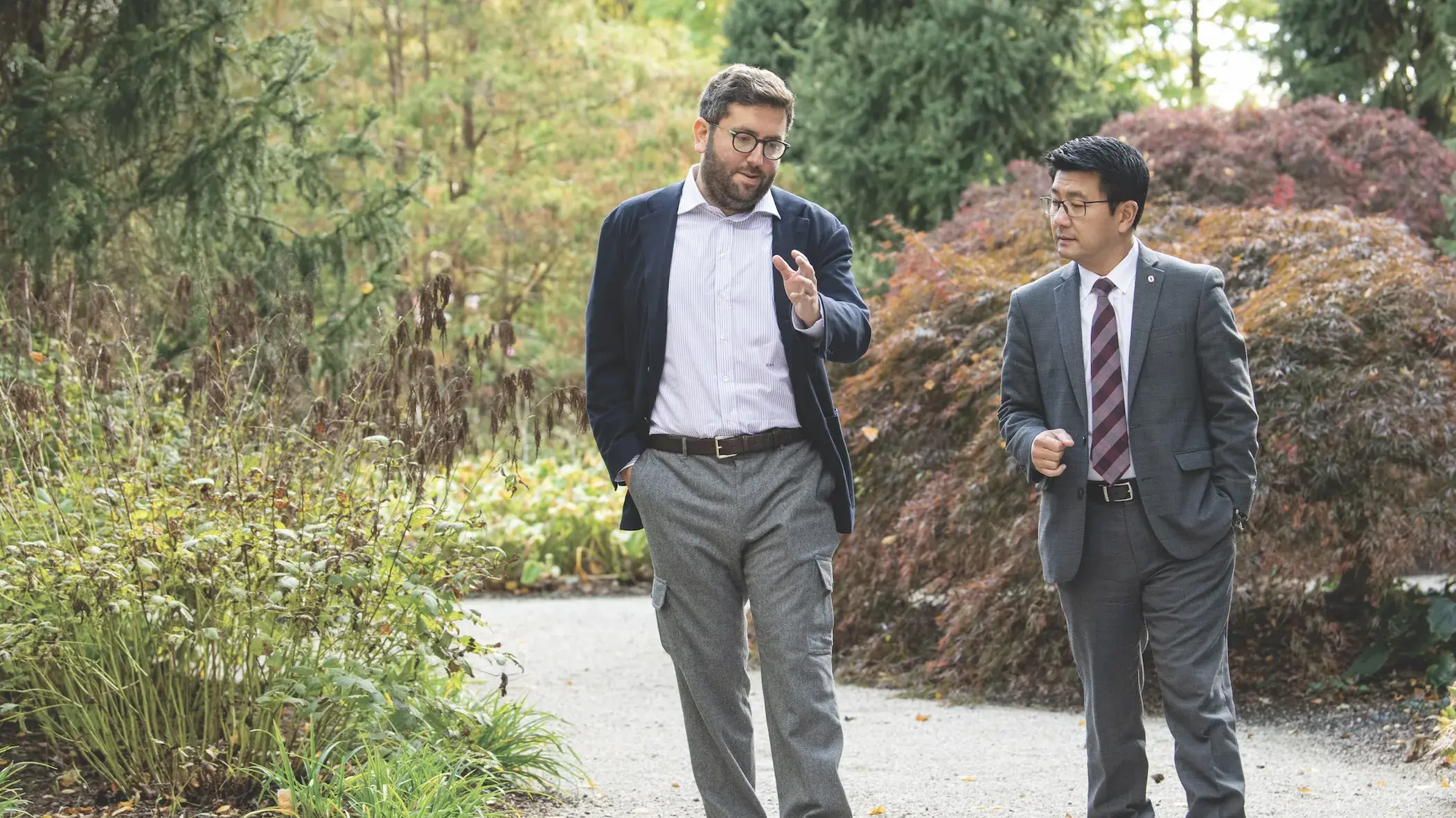 Two men walking outside