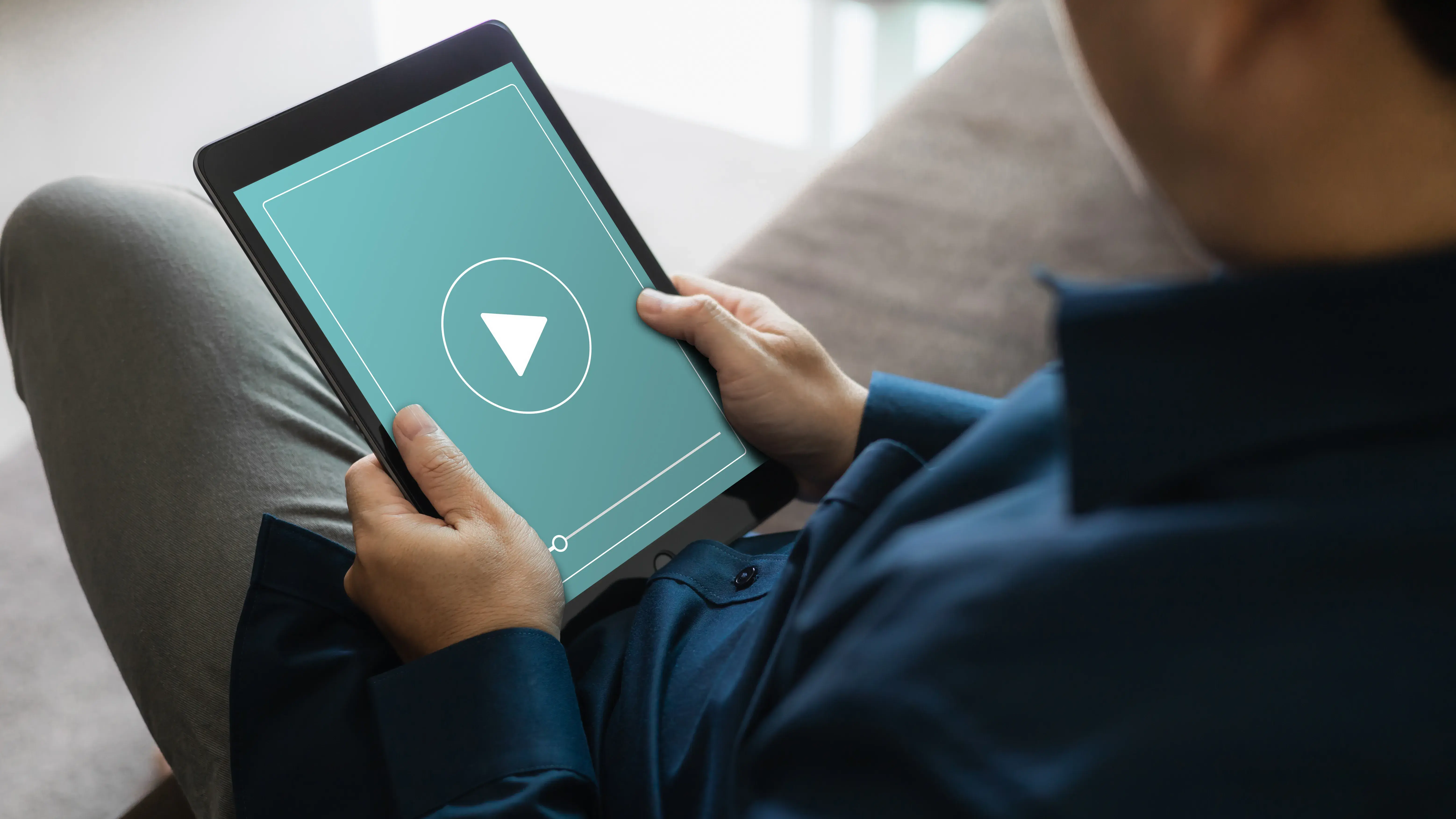 man watching videos on ipad
