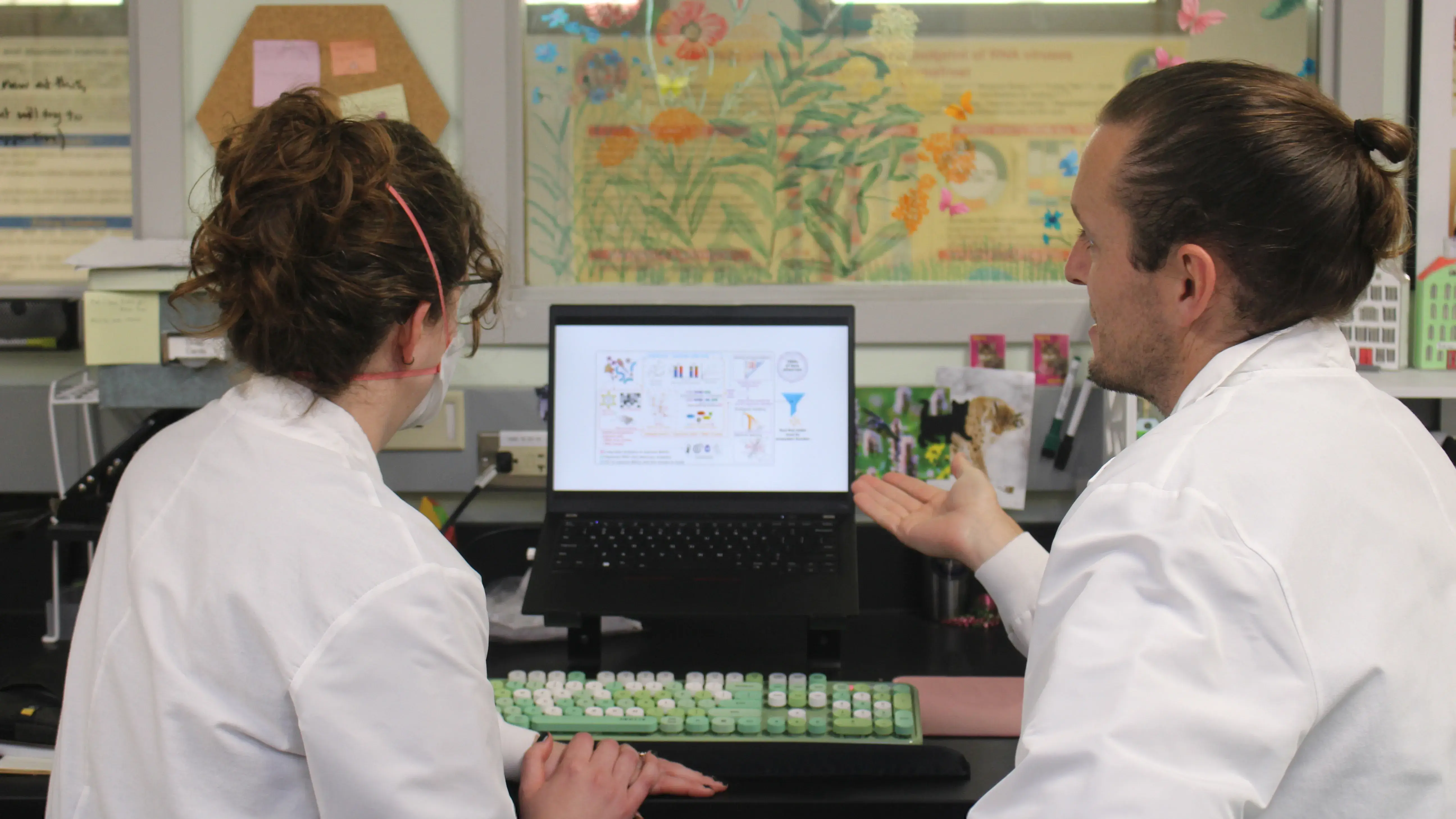 Dr. Garrett Smith explaining microbiomes to researcher