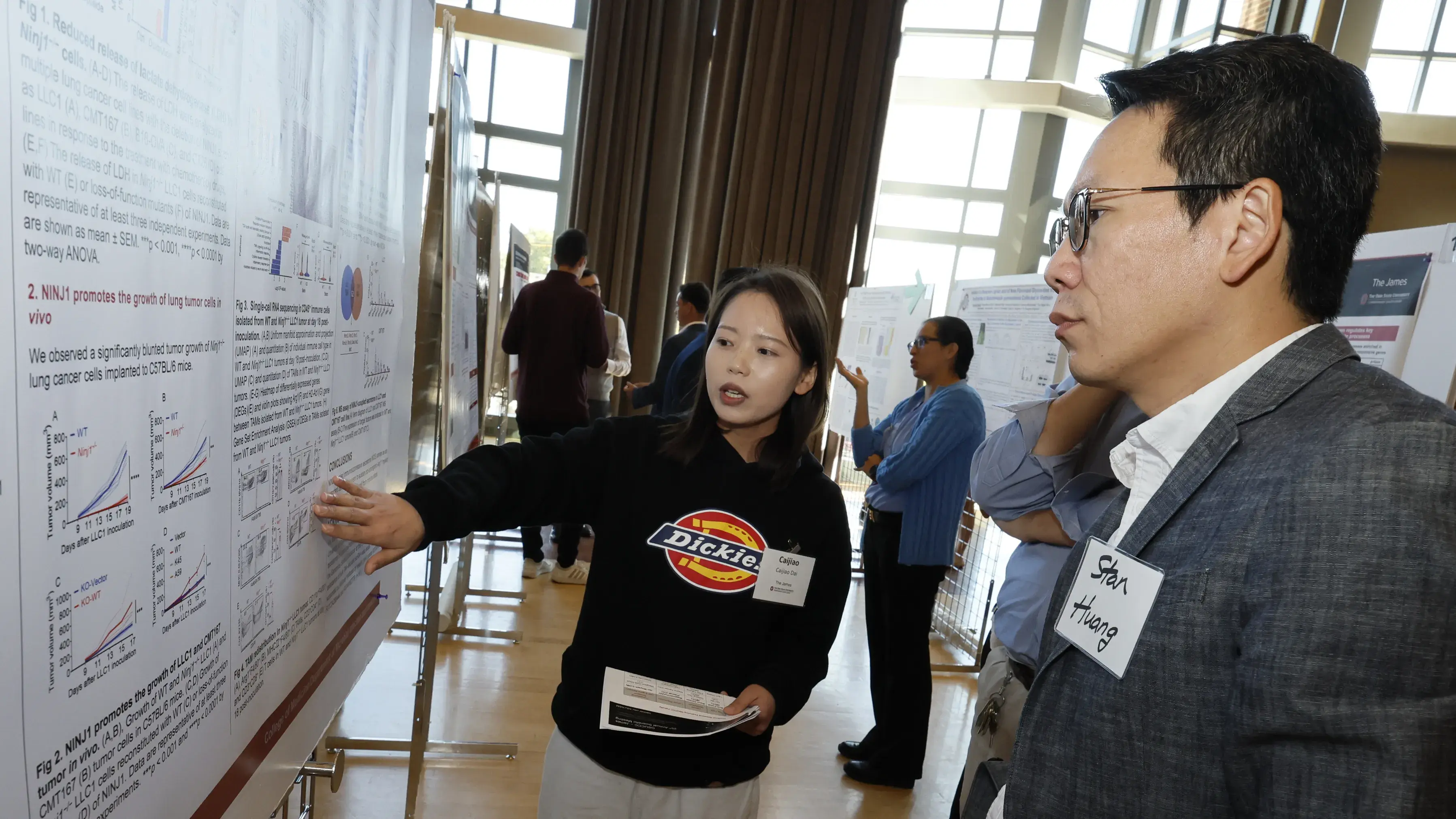 postdoc scholar presenting data to mentor