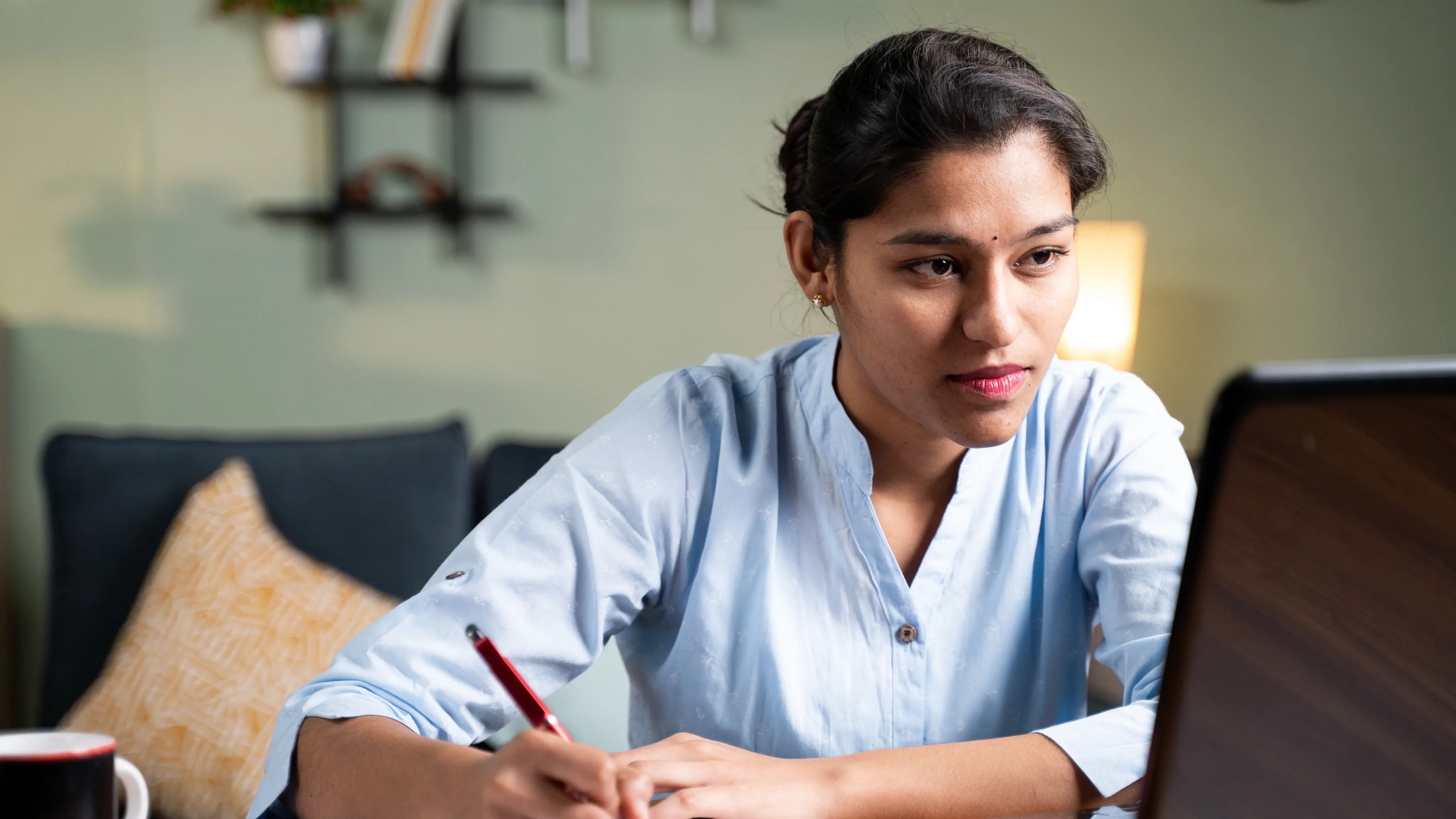 Woman watching online conference