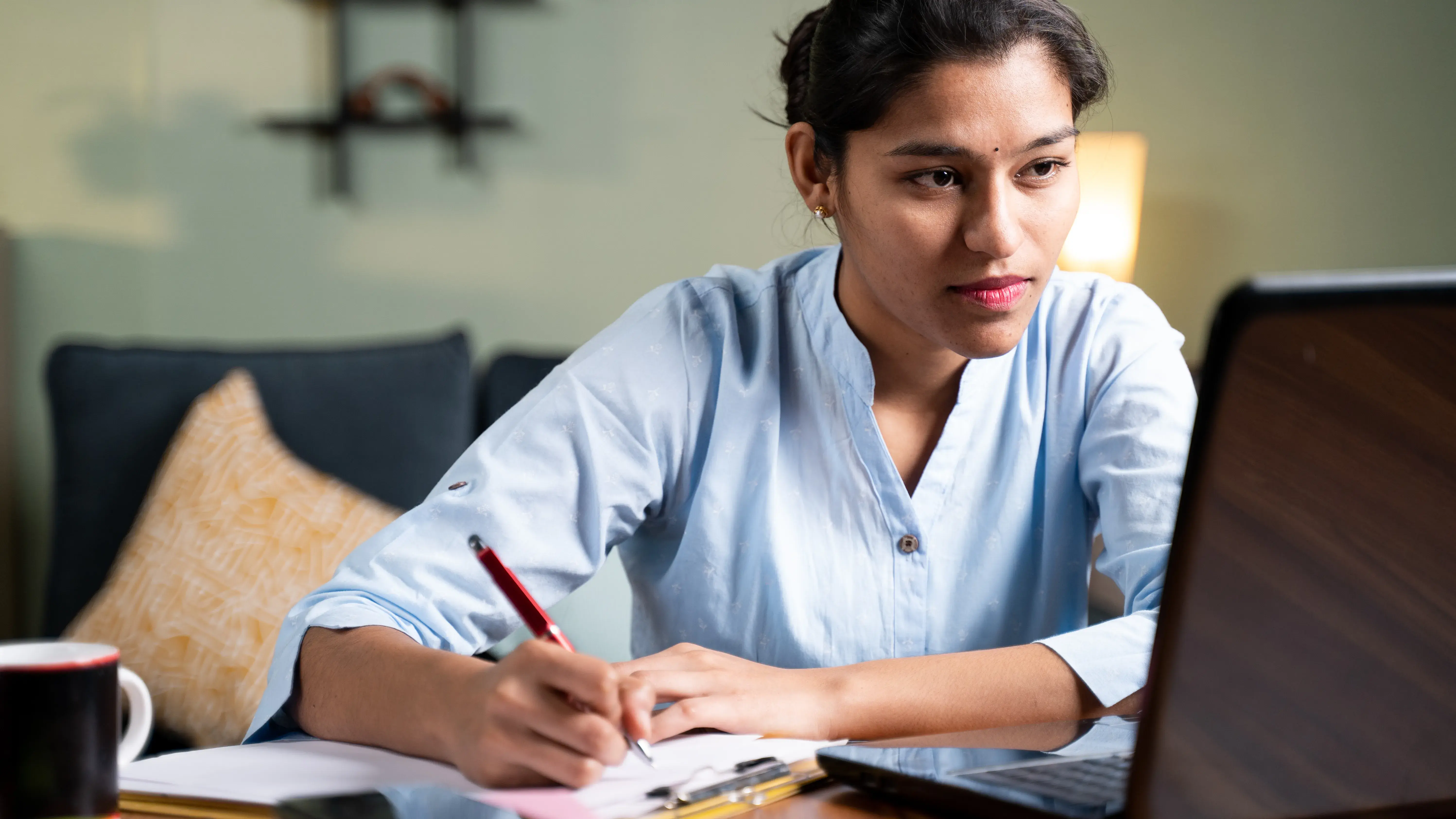 Woman watching online conference