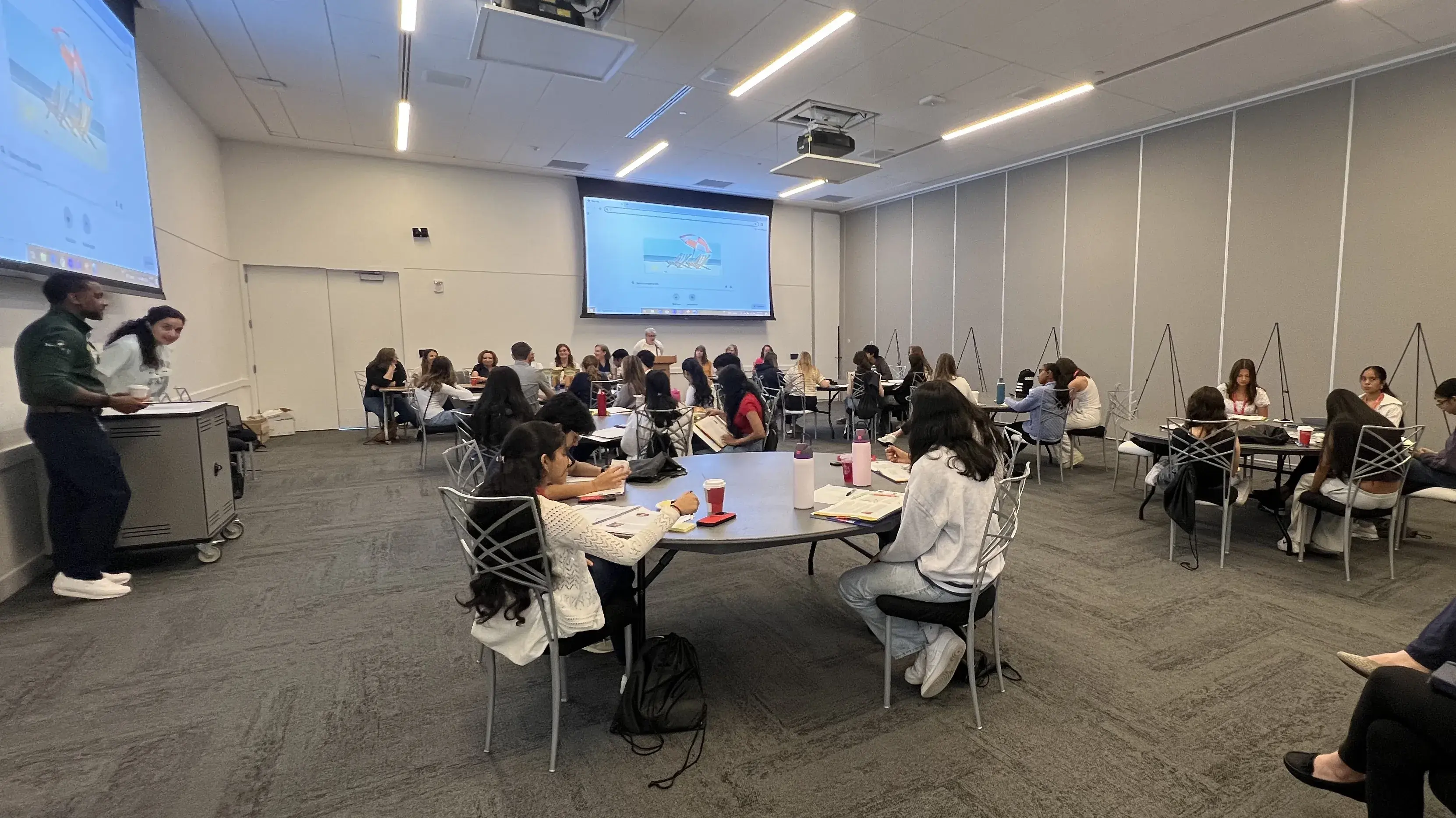 students at round tables