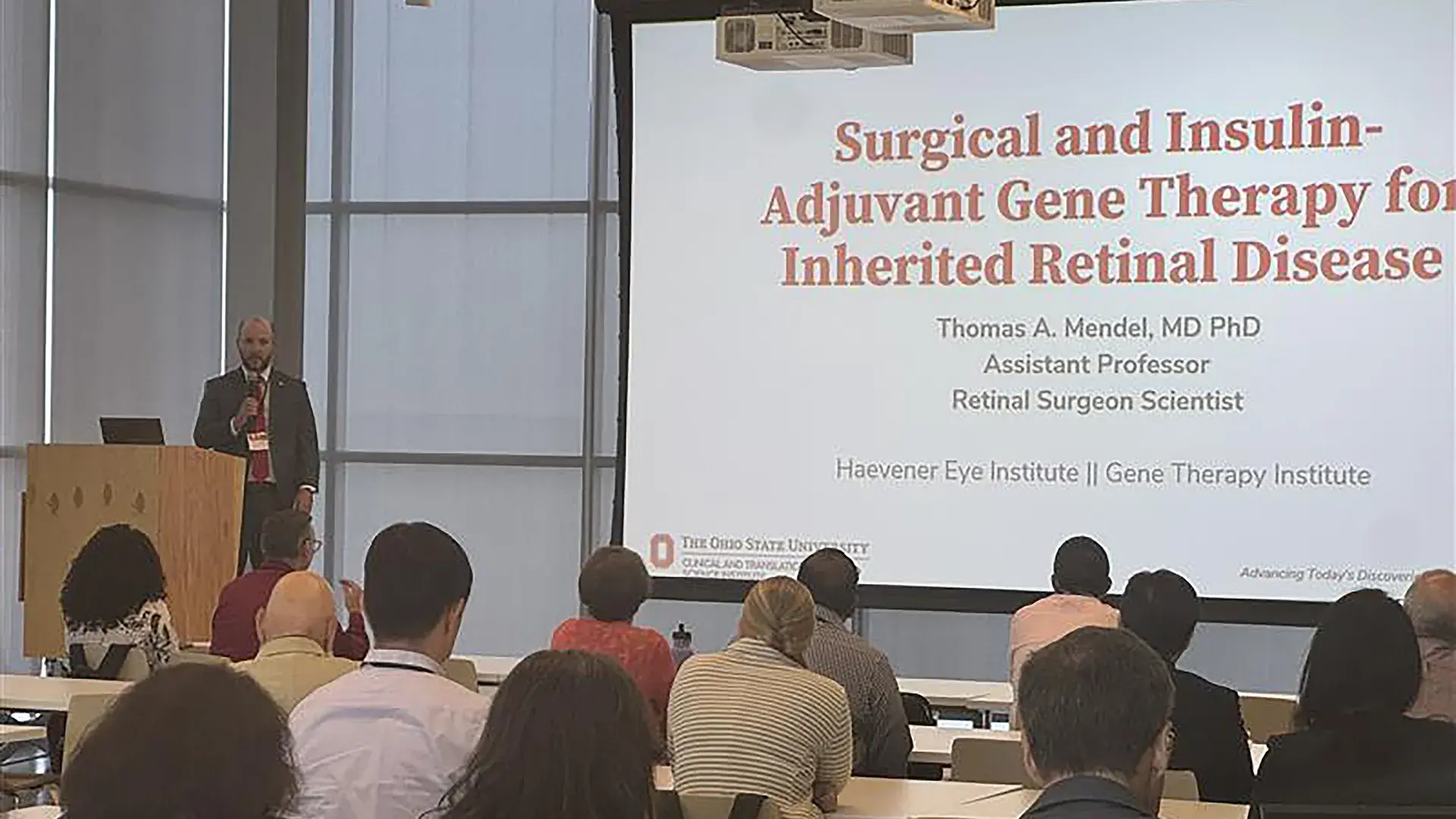 Person at podium giving a presentation